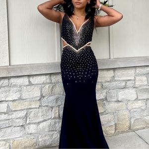 Gorgeous lace up black prom dress with rose gold beading!